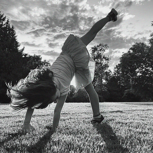 little girl doing gymnastics